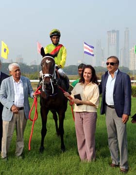 Vijay Shirke, Mrs Liane Luthria and Milan Luthria leading in Kings Gambit (A Prakash up), winner of Kiara Plate at Mumbai on Thursday.